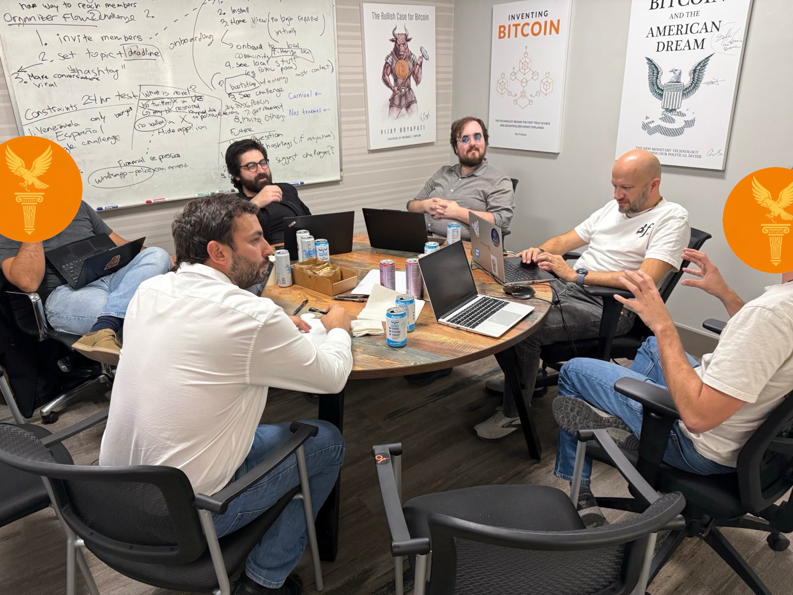 The team in deep discussion around a conference table at Bitcoin Park, planning the Agora architecture
